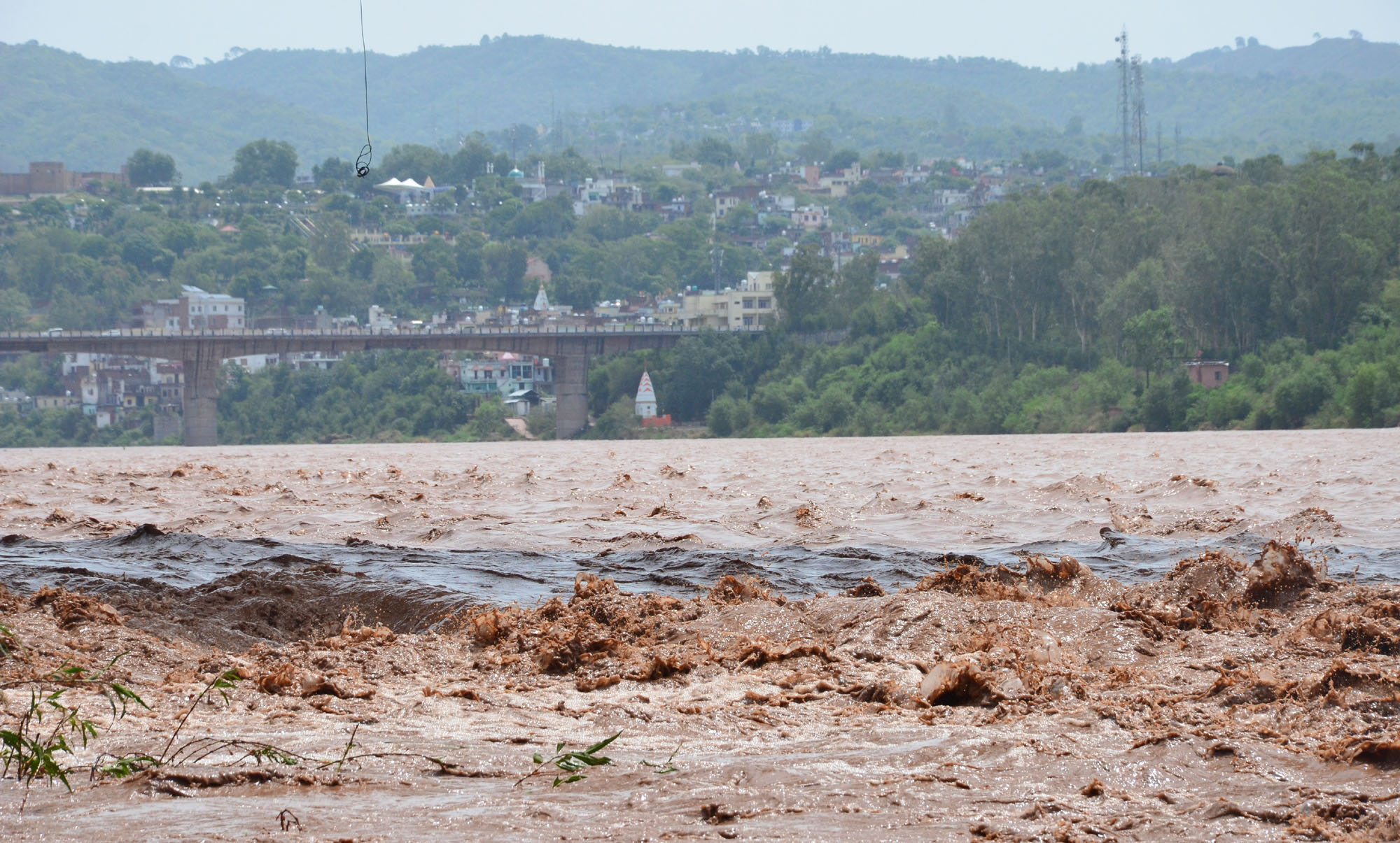 Water overflows the banks of the Tawi River in Jammu on Wednesday, June 22, 2022
