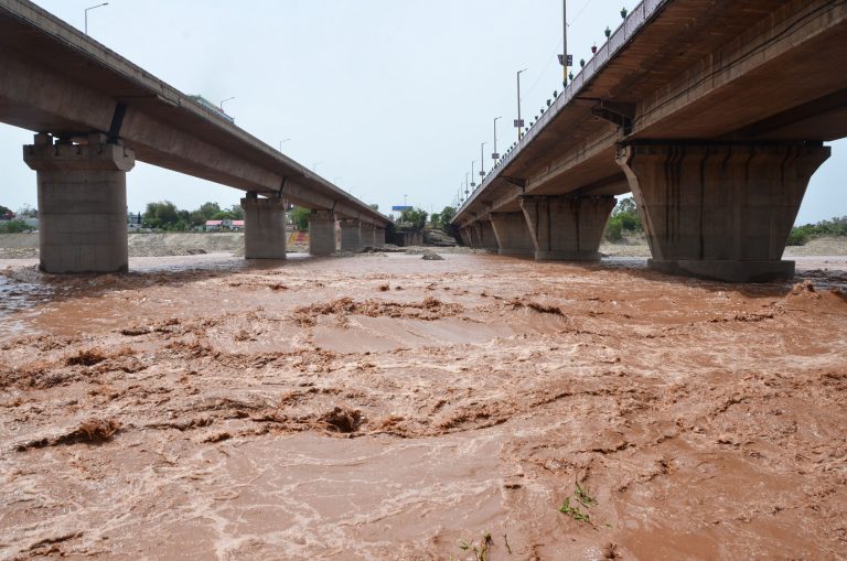 Water overflows the banks of the Tawi River in Jammu on Wednesday, June 22, 2022